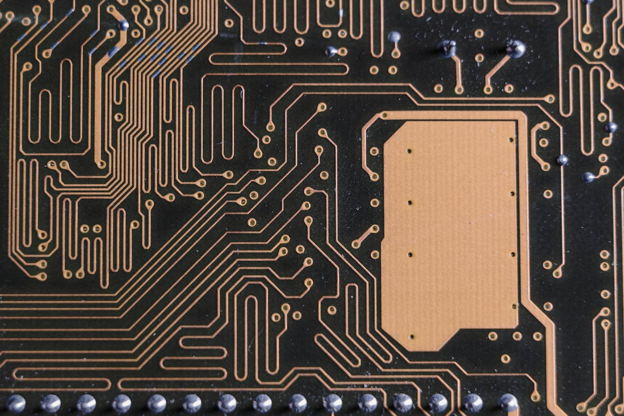 about-01 Detailed view of intricate circuit board patterns in technology hardware.